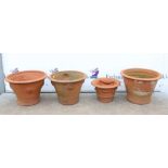 Four terracotta planters of circular tapering form, in differing sizes, H37cm Diameter 53cm,