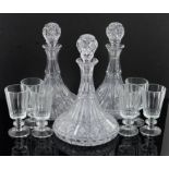 Set of six faceted wine glasses, three glass ships decanters, two cut glass vases and a vase