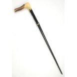 Late 19th century ebonised and white metal mounted sword stick with antler handle, 92cm long,