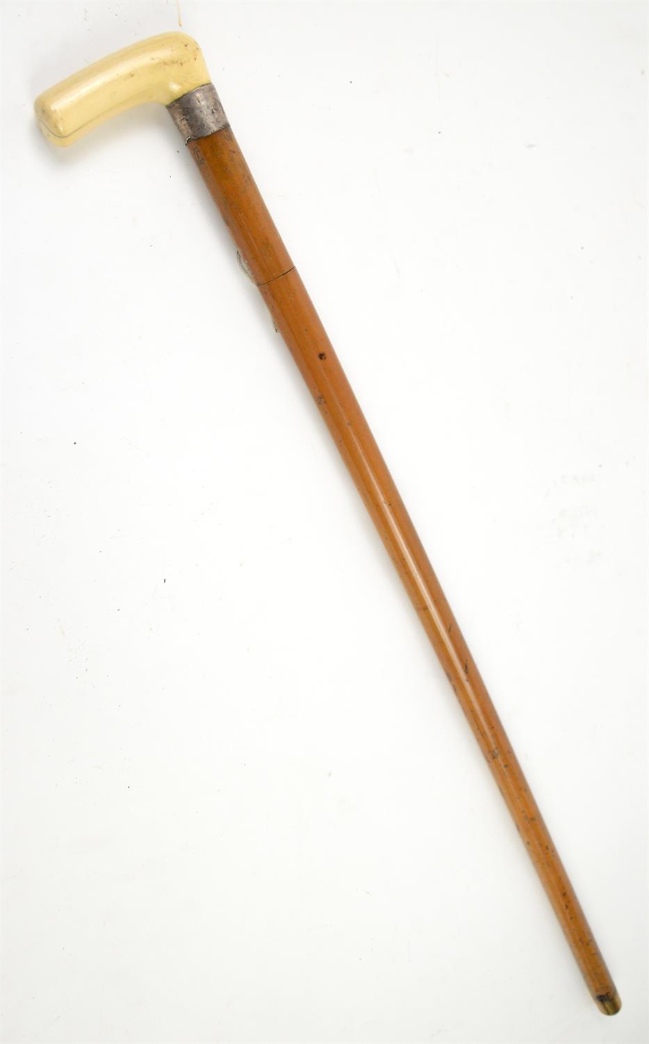 Late 19th century malacca swordstick with carved ivory handle and white metal mount, 82cm long,