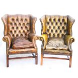 Pair of early 20th century mahogany wingback armchairs, with studded button back leather upholstery,