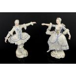 Nymphenburg porcelain figures of male and female dancers dressed in white with blue bows and frills,