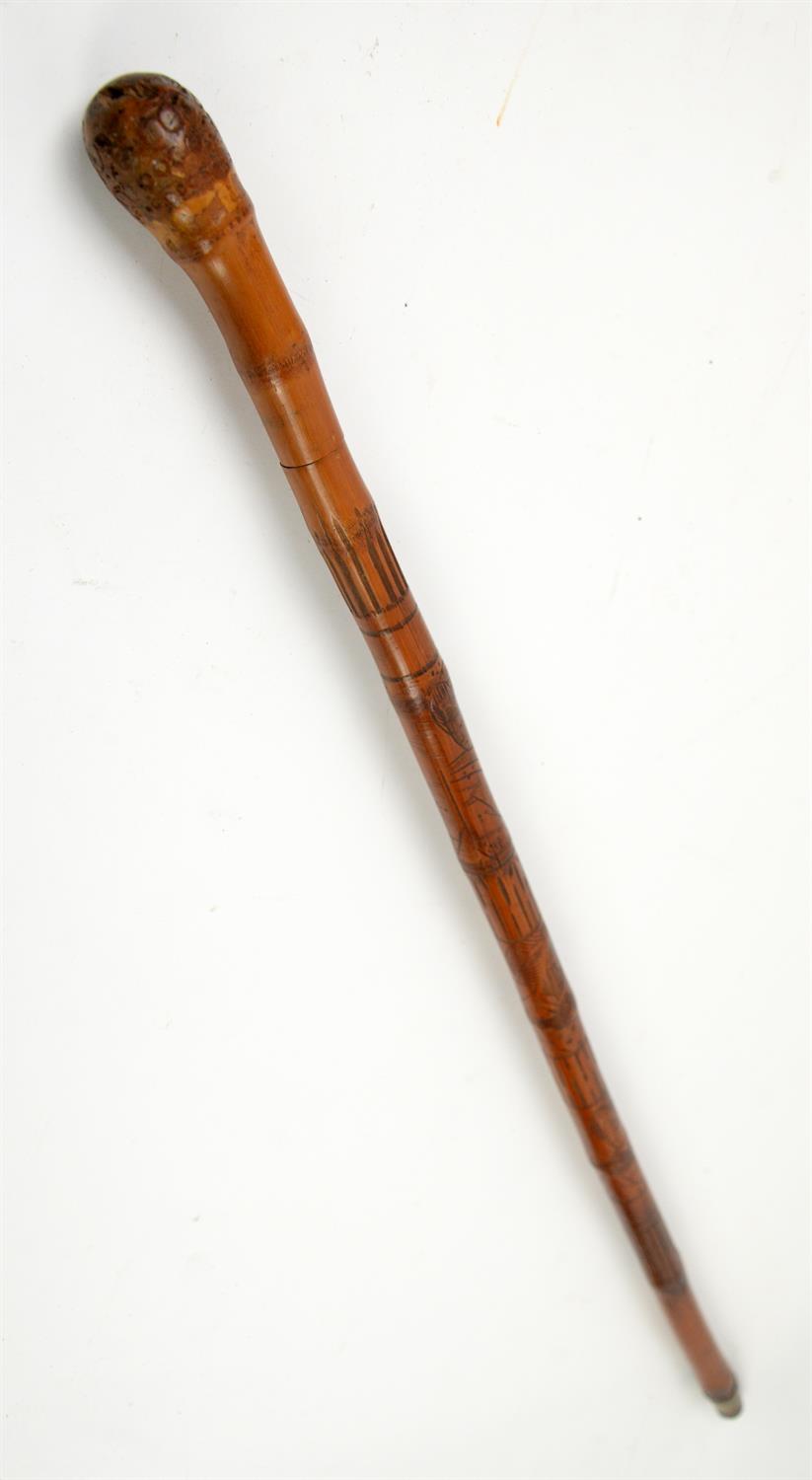 Early 20th century bamboo swordstick, the sheath carved with Oriental ladies, 93cm long,