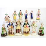 Twelve 19th century Staffordshire figures, including two musicians with striped head scarves,