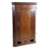 19th century oak corner cupboard, with a single cupboard door with marquetry inlaid shell patera