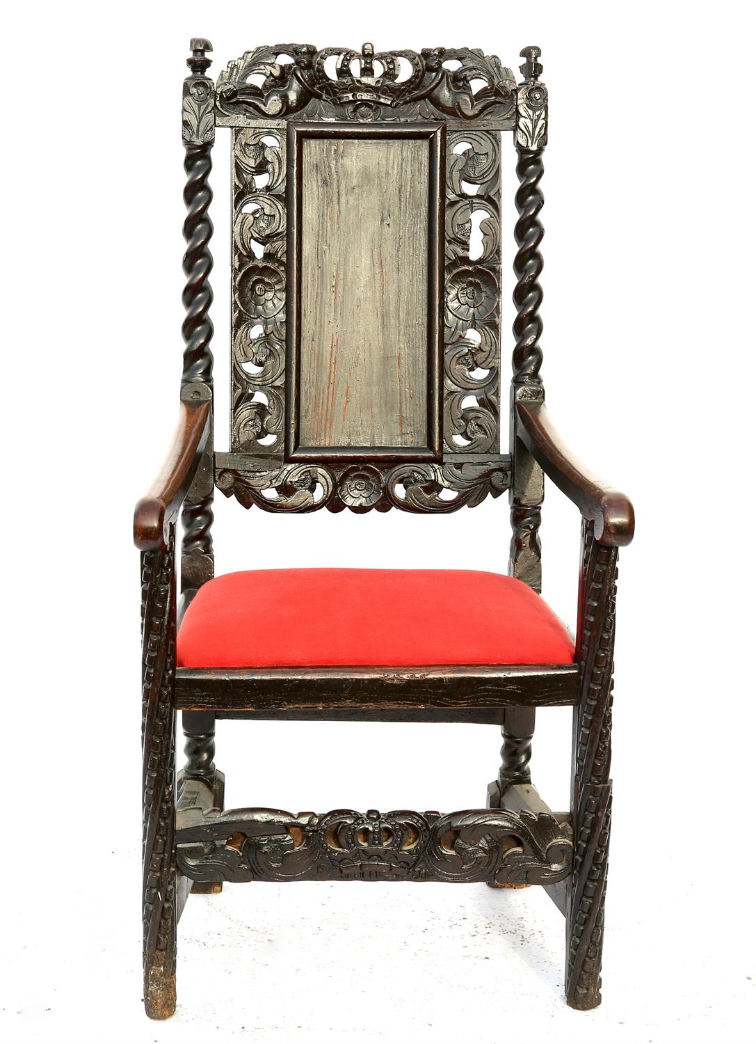 19th century oak wainscot style armchair with carved floral and figural decoration,