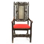 19th century oak wainscot style armchair with carved floral and figural decoration,