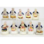 Ten 19th century Staffordshire figures of seated Turkish gentlemen, five as pen holders,