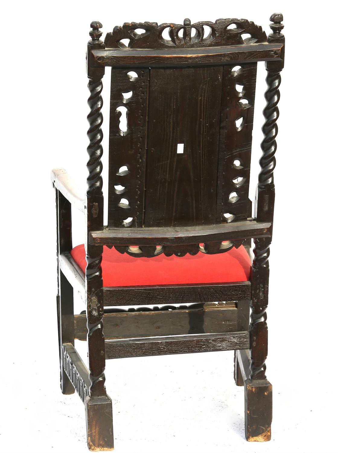 19th century oak wainscot style armchair with carved floral and figural decoration, - Image 2 of 2