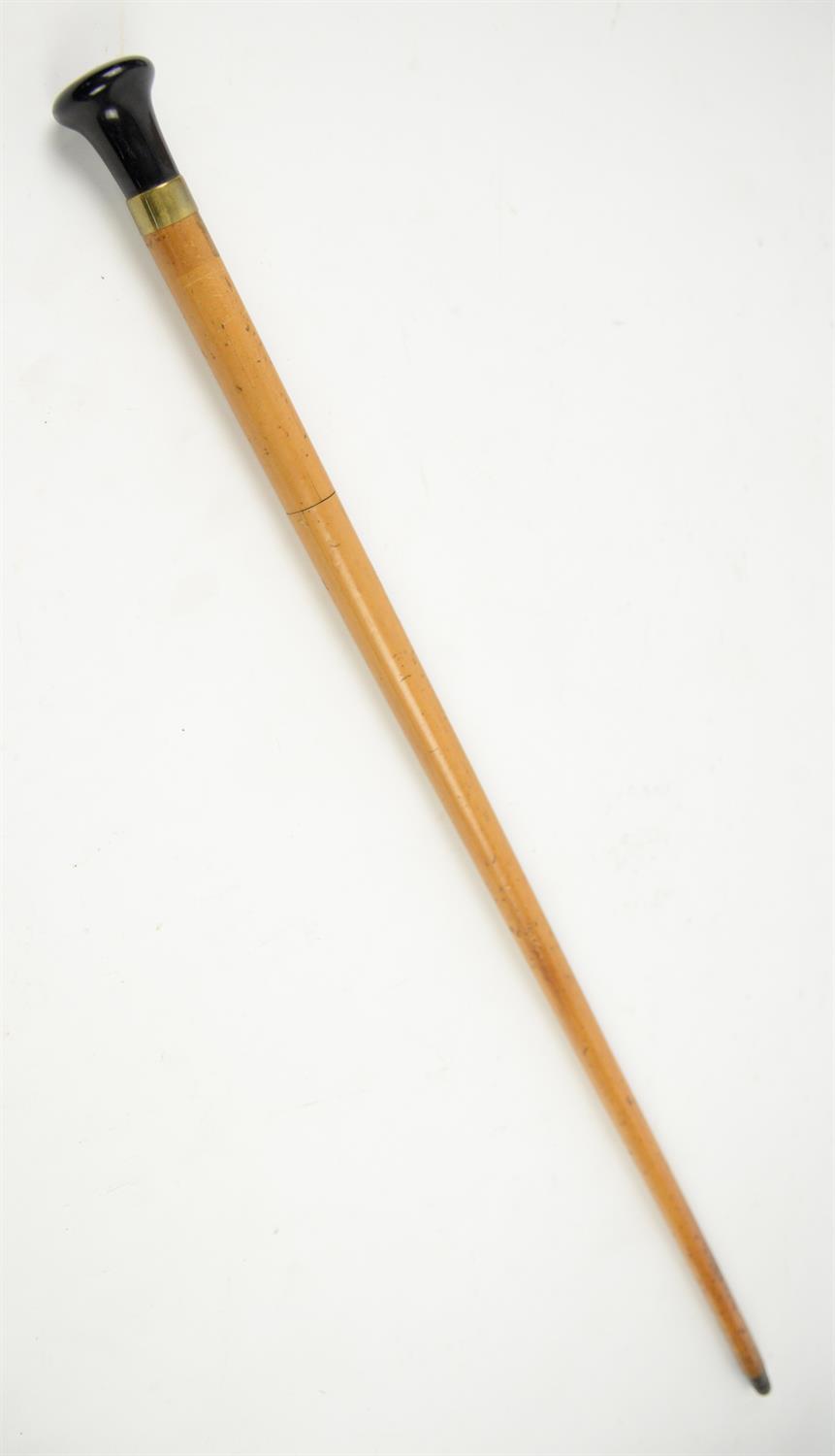Late 19th century malacca swordstick with brass mounted black handle, 91cm long,