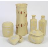Wedgwood Primrose Yellow Jasper Ware to include jar and cover, 9.5cm, a pair of vases, h14cm,