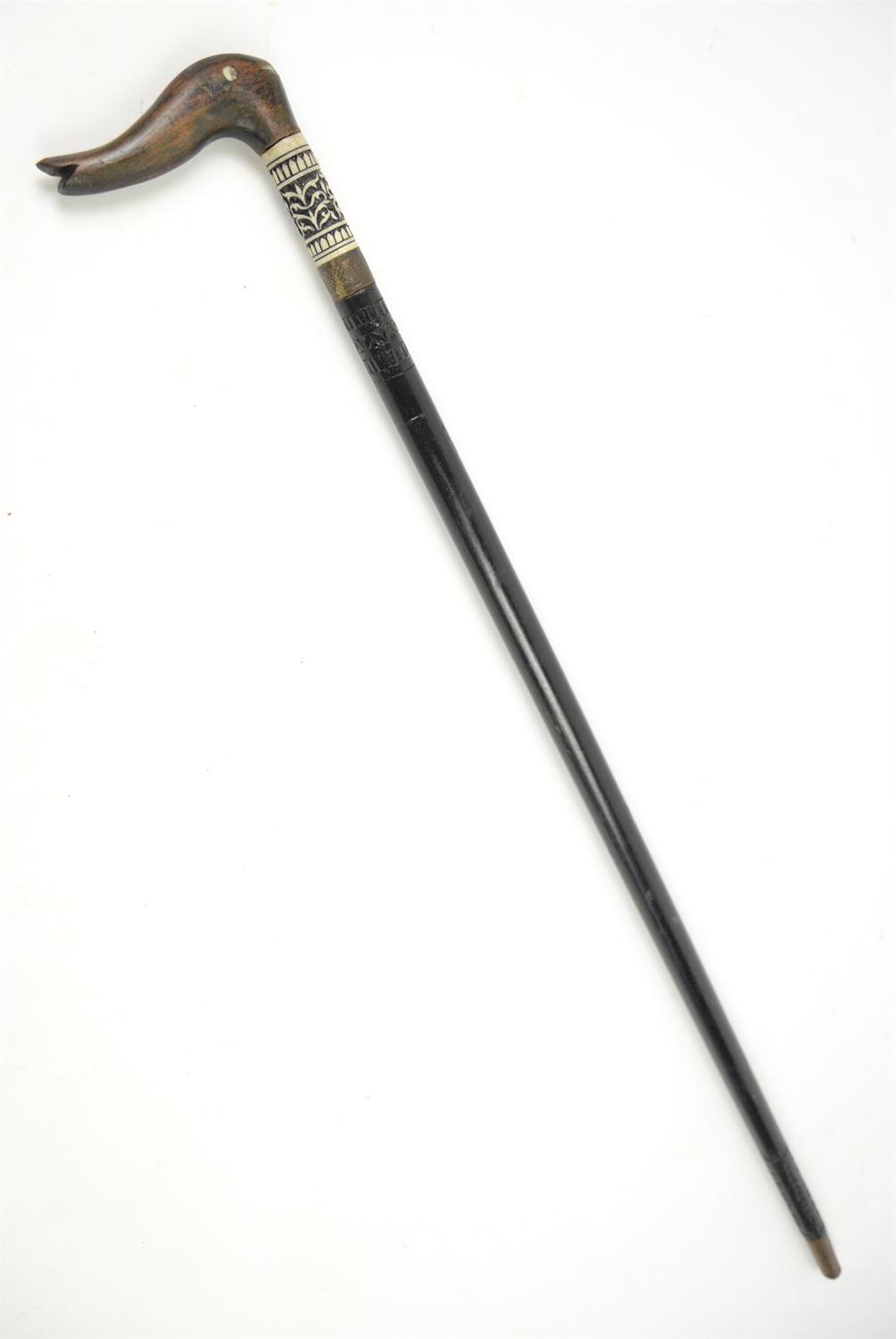 Late 19th century ebonised and bone mounted Indian swordstick with carved hardwood handle,