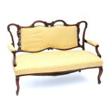 19th century mahogany sofa, with shaped and floral carved top rail and scroll arms,