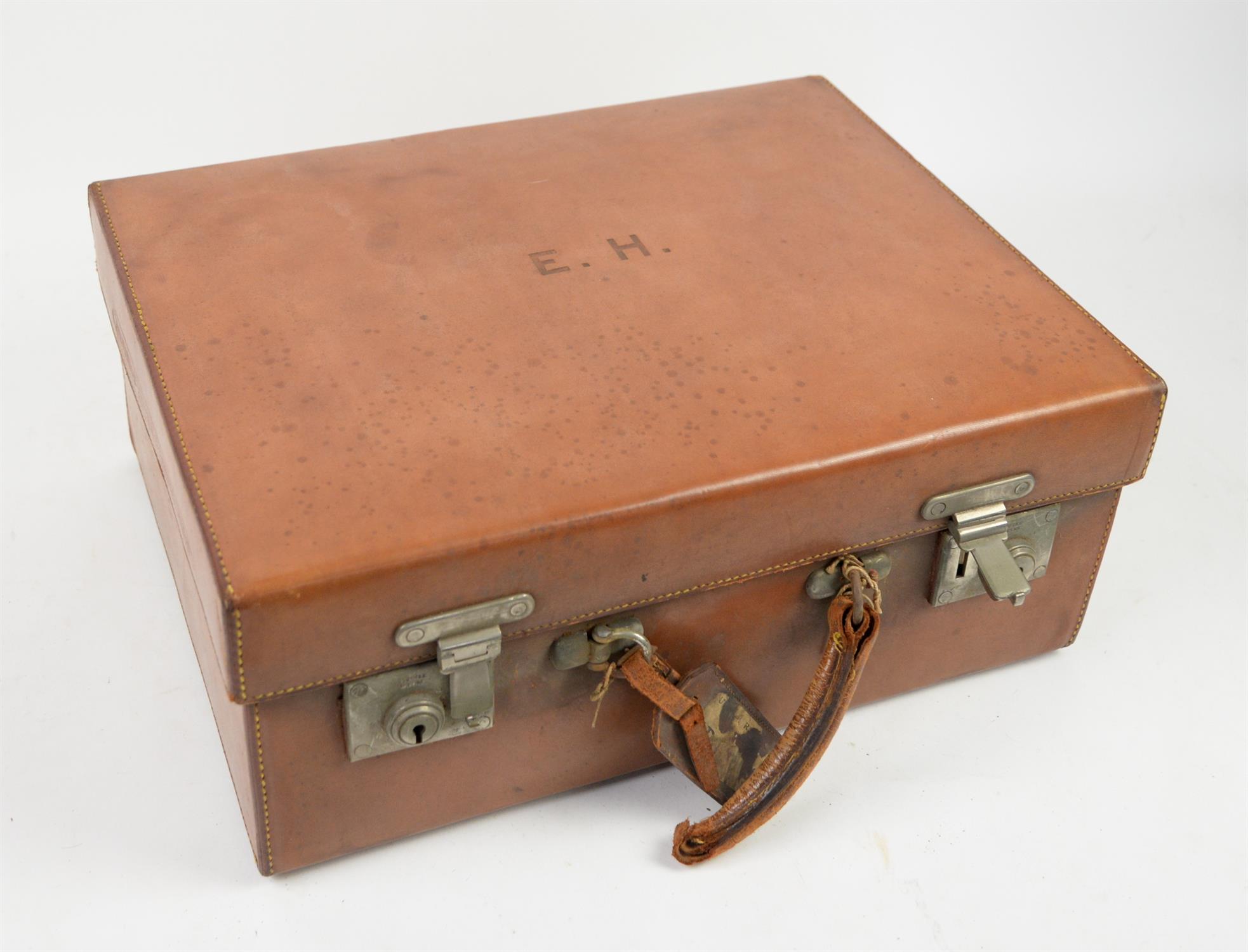Early 20th century brown leather luggage vanity case with monogram E.H., marked for John Pound,