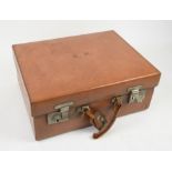 Early 20th century brown leather luggage vanity case with monogram E.H., marked for John Pound,