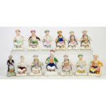 Thirteen 19th century Staffordshire figures of seated Turkish gentlemen, the tallest h14cm