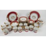 Porcelain tea service decorated with cherubs, pink border and gilt floral swags, comprising 12