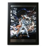 Roger Moore - signed 10 x 8 inch photograph of Moonraker poster artwork, framed.