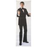 James Bond - Roger Moore signed door panel, plastic coated fabric, loosely folded, 24 x 73 inches.