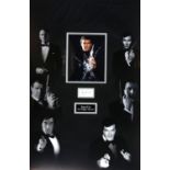 James Bond - Roger Moore signed display showing him as 007, framed, overall 30 x 42 inches.