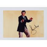 James Bond - Roger Moore signed 12 3/4 x 8 1/4 inch photograph.