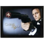 AMENDED DESCRIPTION - James Bond Casino Royale (2006) A $100,000 poker chip signed by Daniel Craig,