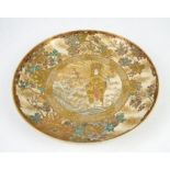 Satsuma charger decorated with The Boddhisatva, Kwannon draped in gold, against a stylised sunburst,