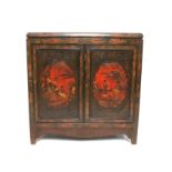 Early 20th century Japanese lacquered cabinet with panelled doors decorated with figures in a