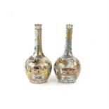 Two late 19th/early 20th century near-matching Chinese bottle vases decorated with landscape scenes,