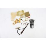 Hair accessories to include three hair combs, a pair of lorgnettes in faux tortoiseshell,