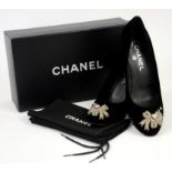 Chanel black evening court shoes with diamante bow and four leaf clover and channel logo, size 38.