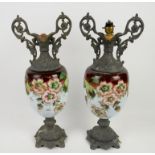 Pair of Victorian floral painted glass vases with scrolling metal mounts and lamp fittings,