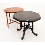 Ebonised octagonal table on reeded supports and shaped legs joined by X-stretcher,