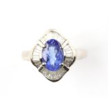 Tanzanite and diamond ballerina ring, with a central oval cut tanzanite weighing an estimated 1.