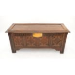 Oak coffer with carved panelled front, H64 x W138 x D52cm