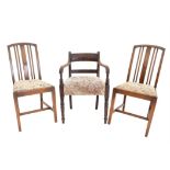 Four 20th century oak chairs, with drop-in floral upholstered seats on square tapered legs,