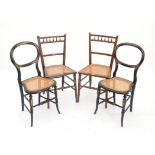 Pair of Victorian ebonised mother of pearl inlaid balloon back chairs with caned seats,