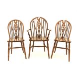 Six oak wheelback chairs, to include two armchairs (6)