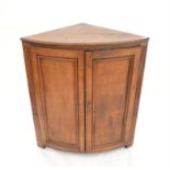 Oak bow fronted corner cupboard, with two cupboard doors, H109 x W95 x D61cm