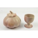 Pink marble sculpture of a pumpkin and a similar goblet