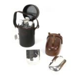 Beretta leather three-decanter case and four metal shot glasses, and a silver plated hip flask and