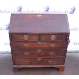 19th century oak bureau with two short over three graduating long drawers, with fitted interior,