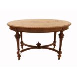 Late 19th century burr walnut oval dining table on turned and reeded legs united by an X-stretcher
