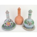 Wedgwood terracotta bottle vase, and two similar in blue with floral decoration and dishes (one