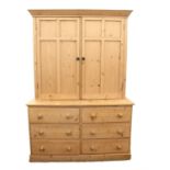 Pine cupboard with two cupboard doors above six drawers on plinth base, H217 x W150 x D61cm