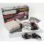 Nintendo Entertainment System NES Action set including console, controllers and zapper gun,