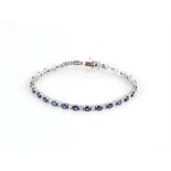 Sapphire and diamond line bracelet, twenty seven round brilliant cut diamonds, estimated total