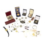 A group of costume jewellery to include hairclips, eagle belt buckle and commemorate coins and