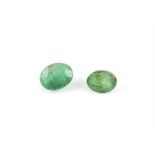 Three oval cut loose emeralds, one with an estimated weight 3.37 carats, another 2.94 carats and 2.
