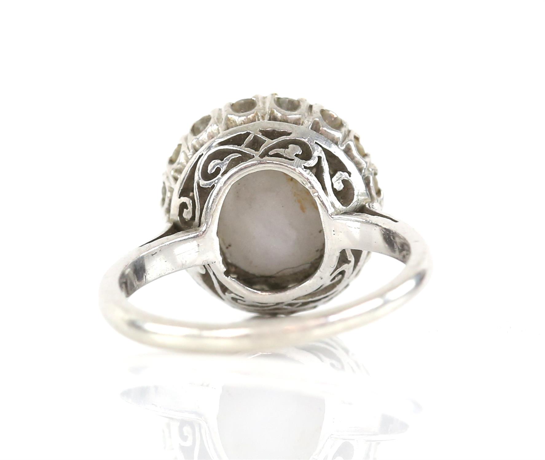 Star sapphire and diamond cluster ring, central oval cabochon cut sapphire, estimated weight 6. - Image 3 of 4